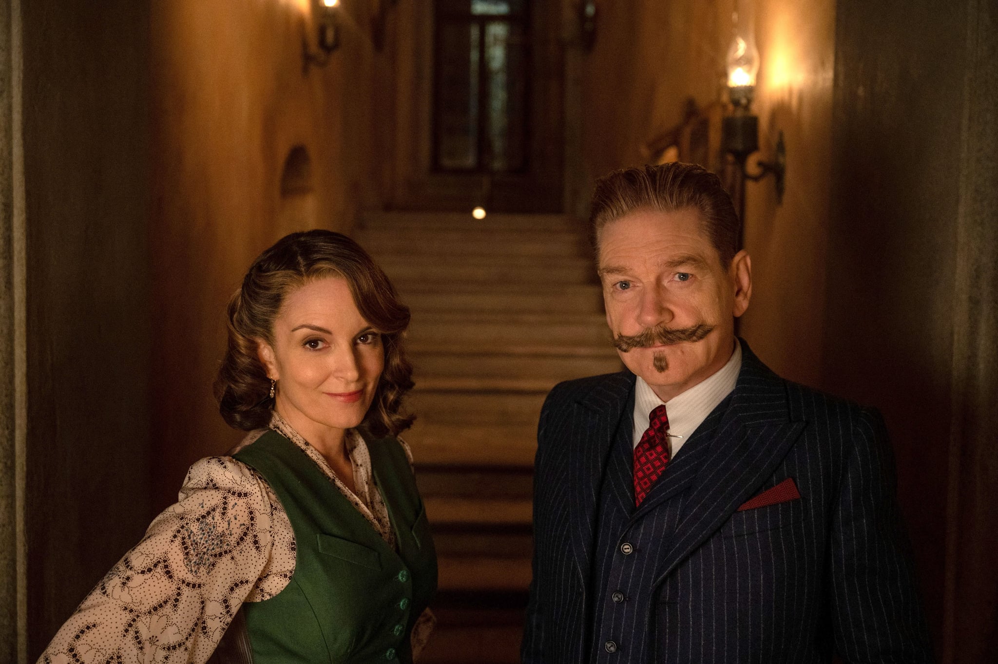 A HAUNTING IN VENICE, from left: Tina Fey, Kenneth Branagh as Hercule Poirot, 2023. ph: Rob Youngson /  Walt Disney Studios Motion Pictures /Courtesy Everett Collection