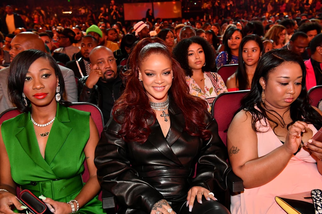 Surprise! After three long years, Rihanna returned to the BET Awards on Sunday. The 31-year-old singer — and world's richest female musician — somehow managed to skip the red carpet and make her way inside undetected, however, cameras finally spotted her when she was cheering on Lizzo during her energetic "Truth Hurts" performance. Even though Rihanna's appearance was unannounced, she was on hand to present Mary J. Blige with the lifetime achievement award. During her speech, Rihanna praised Mary for "forever aligning the worlds of hip-hop and R&B" and "changing the game with her unique sound." She also linked up with Wale and Billy Ray Cyrus after he took the stage for "Old Town Road" with Lil Nas X. Yep, Rihanna at the BET Awards is a whole mood!