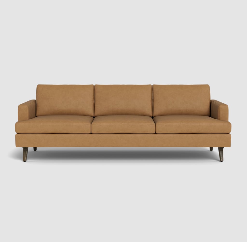 Albany Park Lido Sofa in Tan Vegan Leather ($1,621, originally $2,494)
Not being dramatic, my whole life changed when I realized I could sit (and sleep) comfortably on leather sofas. Growing up, I'd visit family and eventually start sneezing and itching from just sitting on their furniture. Add a pet into the mix and I'm seconds away from pulling out my asthma inhaler. Leather furniture doesn't harbor dust mites or pet dander, and it's easier to wipe down and keep allergen-free. When it was time to buy a sofa for my own home, I knew I'd want a leather option. The Lido sofa comes highly recommended, as it's gorgeous and cozy plus simple and stress-free to put together (it took me less than 30 minutes). Our editor had only great things to say in her Albany Park Lido Sofa review. 
Editor Quote: "The Albany Park Lido Sofa is a dream come true for anyone looking for a stylish, easy-to-assemble, and comfortable sofa that's built to last. It's perfect for those who want to customize their sofa to align with their aesthetic vision without dropping upwards of $5,000 on a custom design. While it's definitely an investment, it's a solid choice for anyone who wants a sofa that's both chic and functional. Plus, it's perfect for families and pet owners, thanks to its durable fabric and removable cushions." — Marisa Petrarca, former contributing shopping editor
