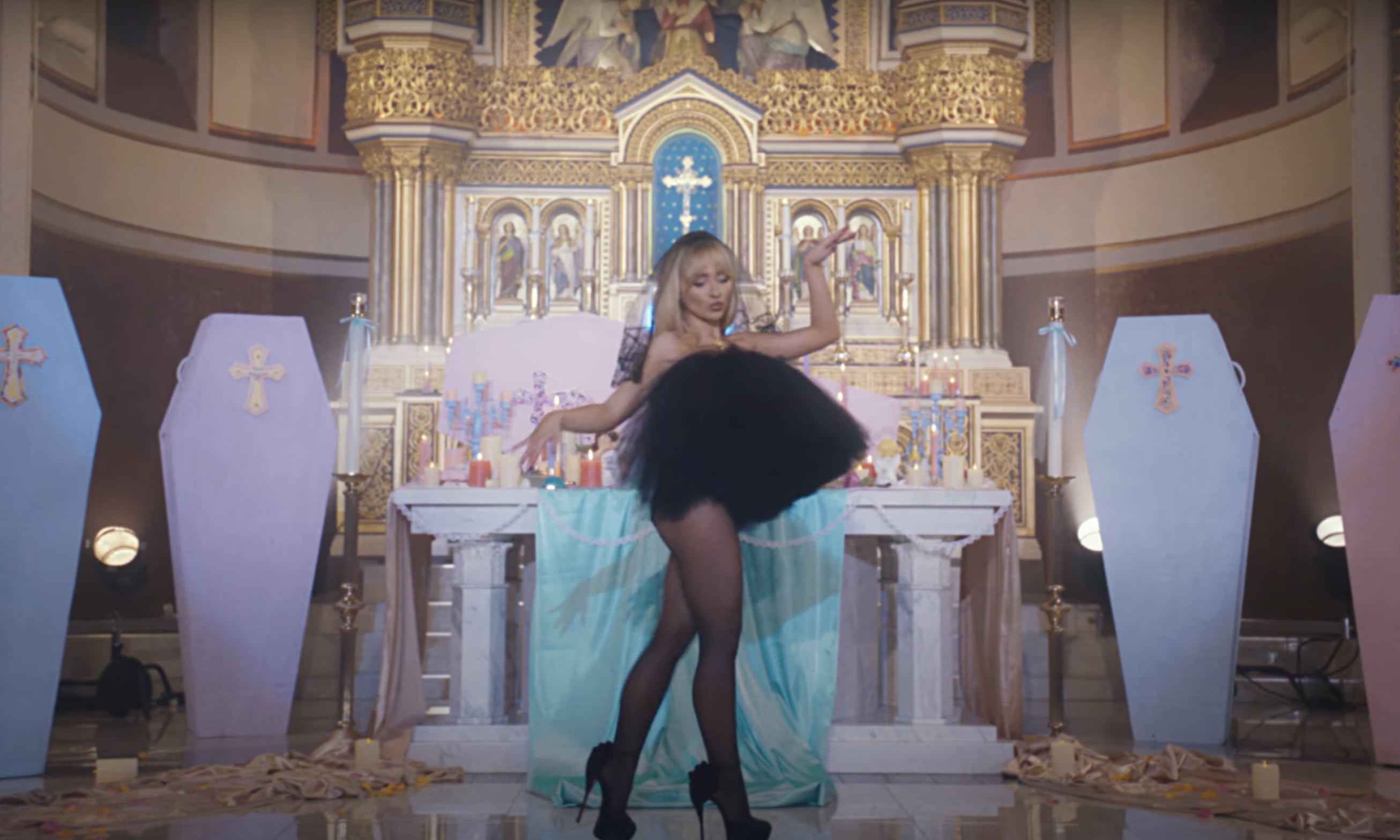 sabrina carpenter feather black dress Here's How to Copy Sabrina Carpenter's Coquette Braids in the "Feather"  Video