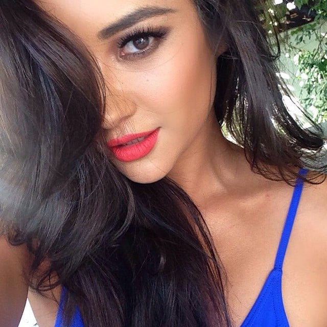 Shay Mitchell stunned in a red lip and smoky eye shadow look. 
Source: Instagram user shaym