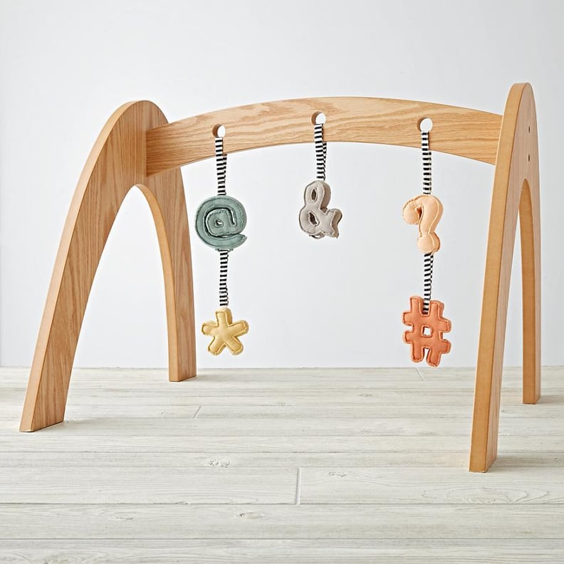 Land of Nod Wooden Baby Gym With Punctuation Rattles