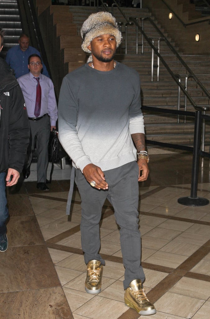 Usher wore a fur hat when he arrived at LAX on Thursday.