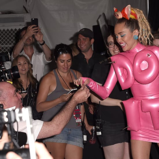 Miley Cyrus Shares a Joint With Photographers at VMAs
