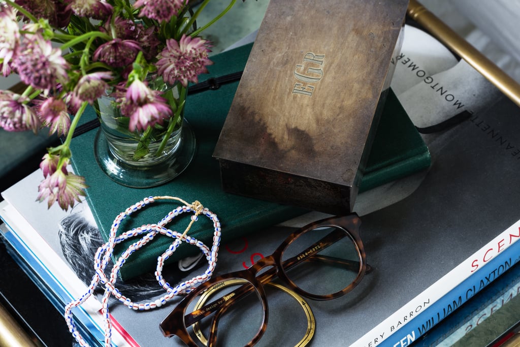 Lizzie suggests keeping a lidded box on the bedside table to store the odds and ends that can make the surface look messy. Here, her husband's glasses add a lived-in look.