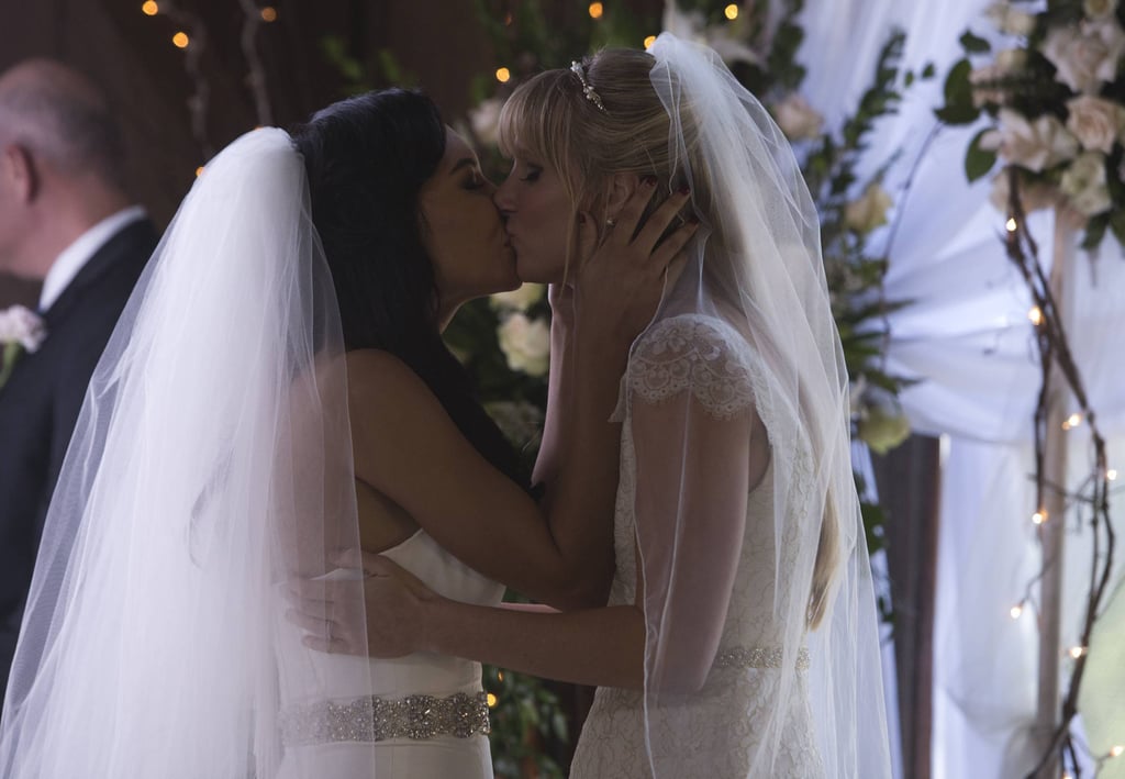 The two ladies have their first kiss as bride and bride.