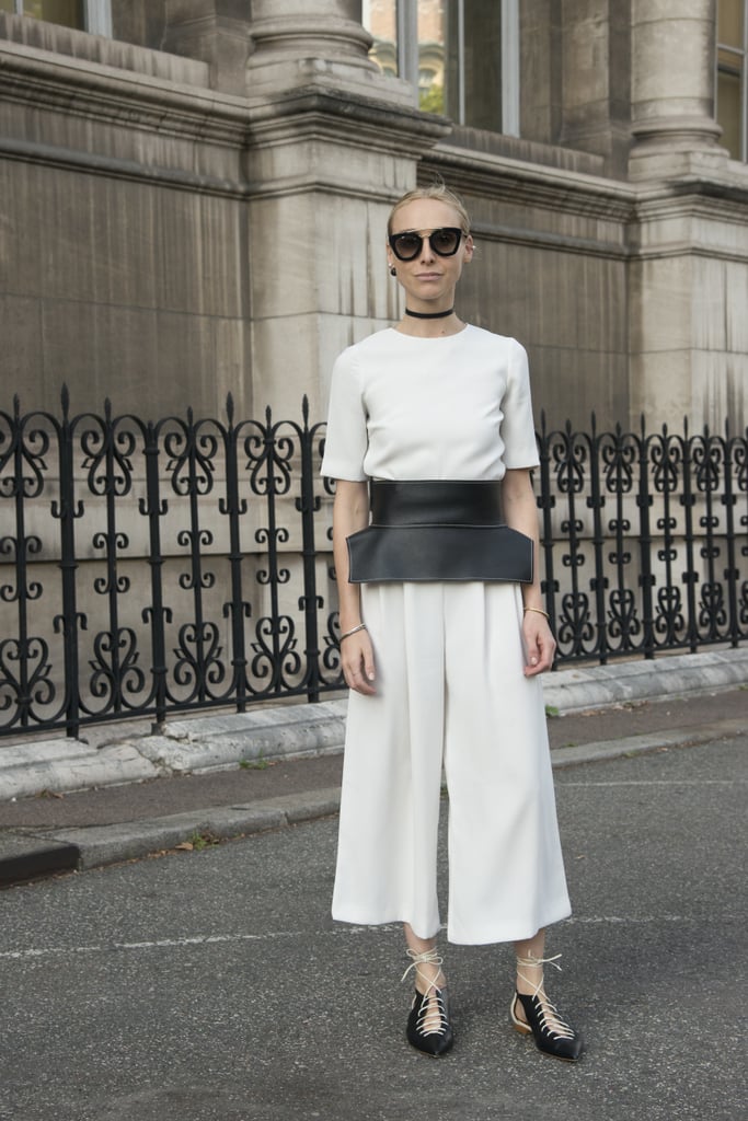 Take a white jumpsuit to the next level with a thick black belt.