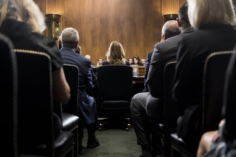 WASHINGTON, DC - SEPTEMBER 27: Dr. Christine Blasey Ford (C) takes her seat to testify on Capitol Hill September 27, 2018 in Washington, DC. A professor at Palo Alto University and a research psychologist at the Stanford University School of Medicine, For