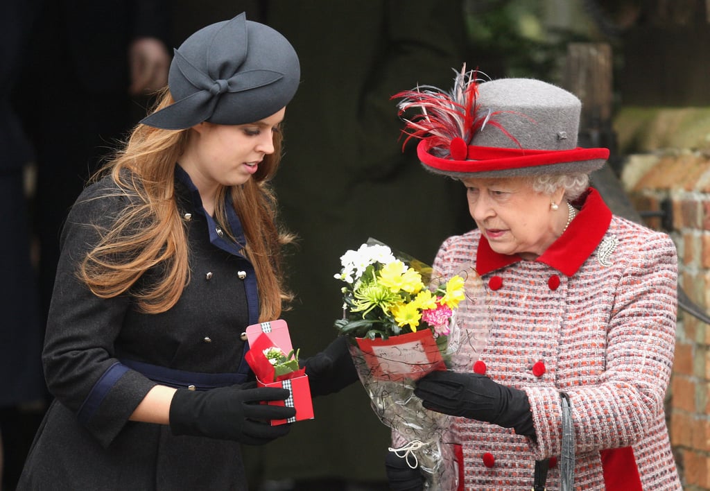 Princess Beatrice helped her grandmother carry all her flowers on Christmas in 2008.