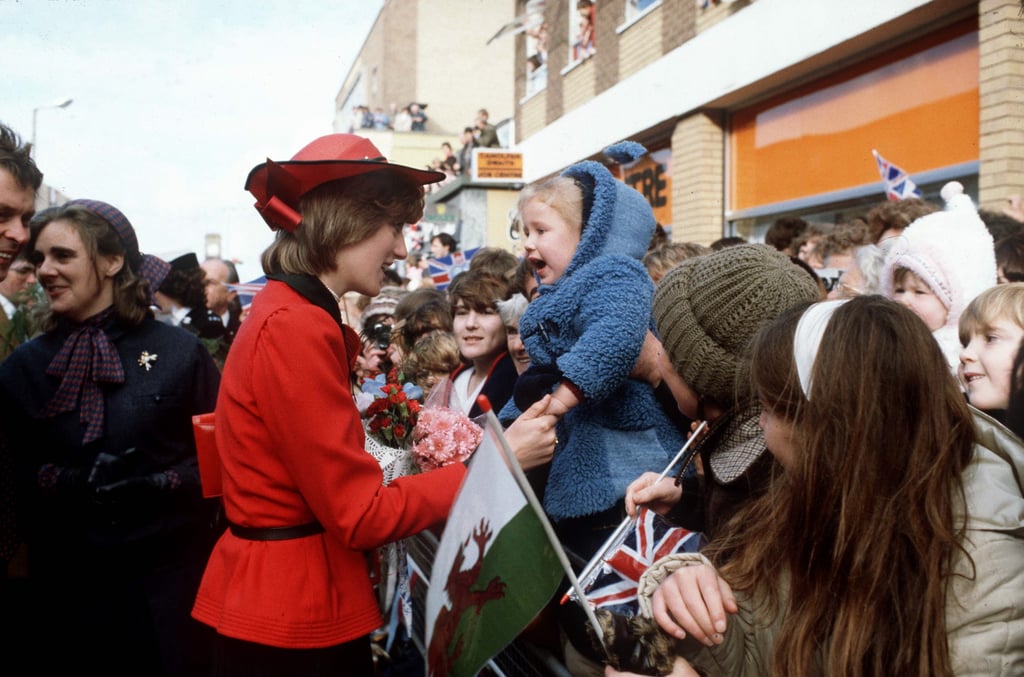 A young child looked quite happy to meet Diana during her visit to Rhyl, Wales, in October 1981.