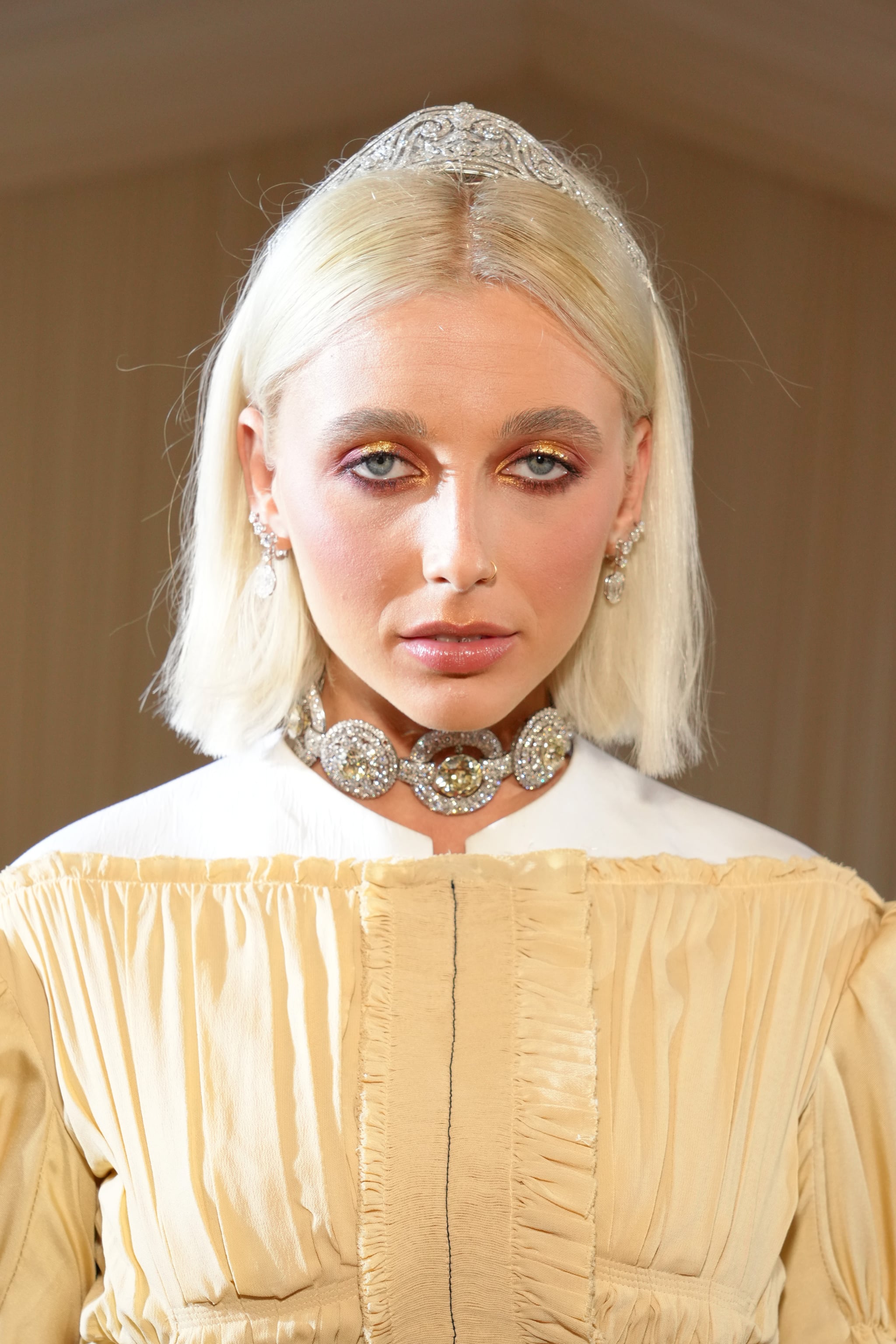 Emma Chamberlain Gets Bold in Vuitton Crop Top & Heels at Met Gala