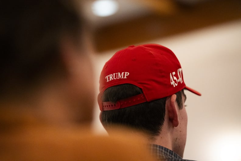 man wearing a Trump hat