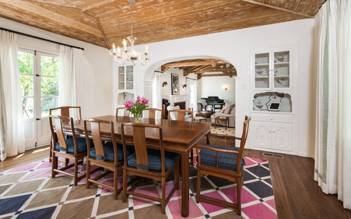 The decor throughout the whole home offers a cozy yet sophisticated feel, and the wooden ceiling beams give it a rustic touch.