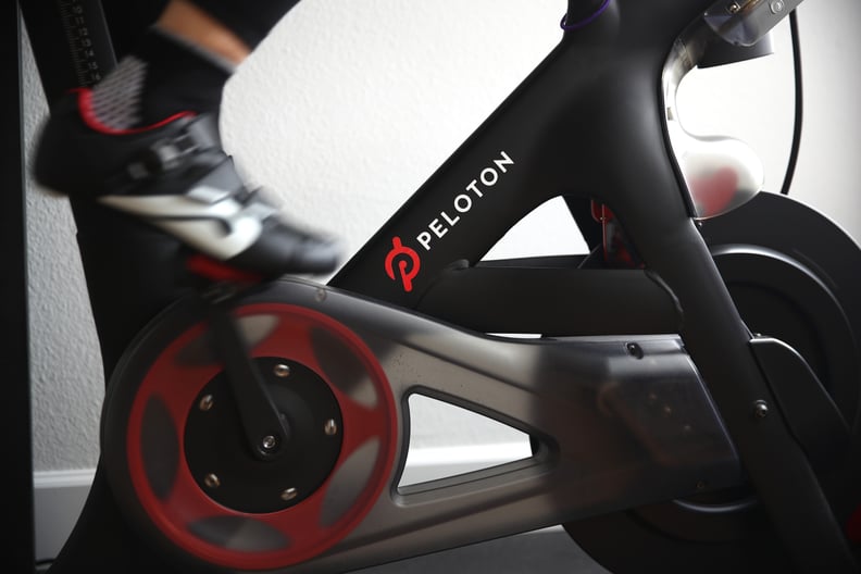 SAN ANSELMO, CALIFORNIA - APRIL 06: Cari Gundee rides her Peloton exercise bike at her home on April 06, 2020 in San Anselmo, California.  More people are turning to Peloton due to shelter-in-place orders because of the coronavirus (COVID-19). Peloton sto