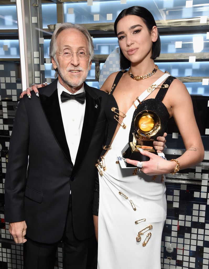 Photos from Dua Lipa's big night out, including a photo op with Neil Portnow himself: