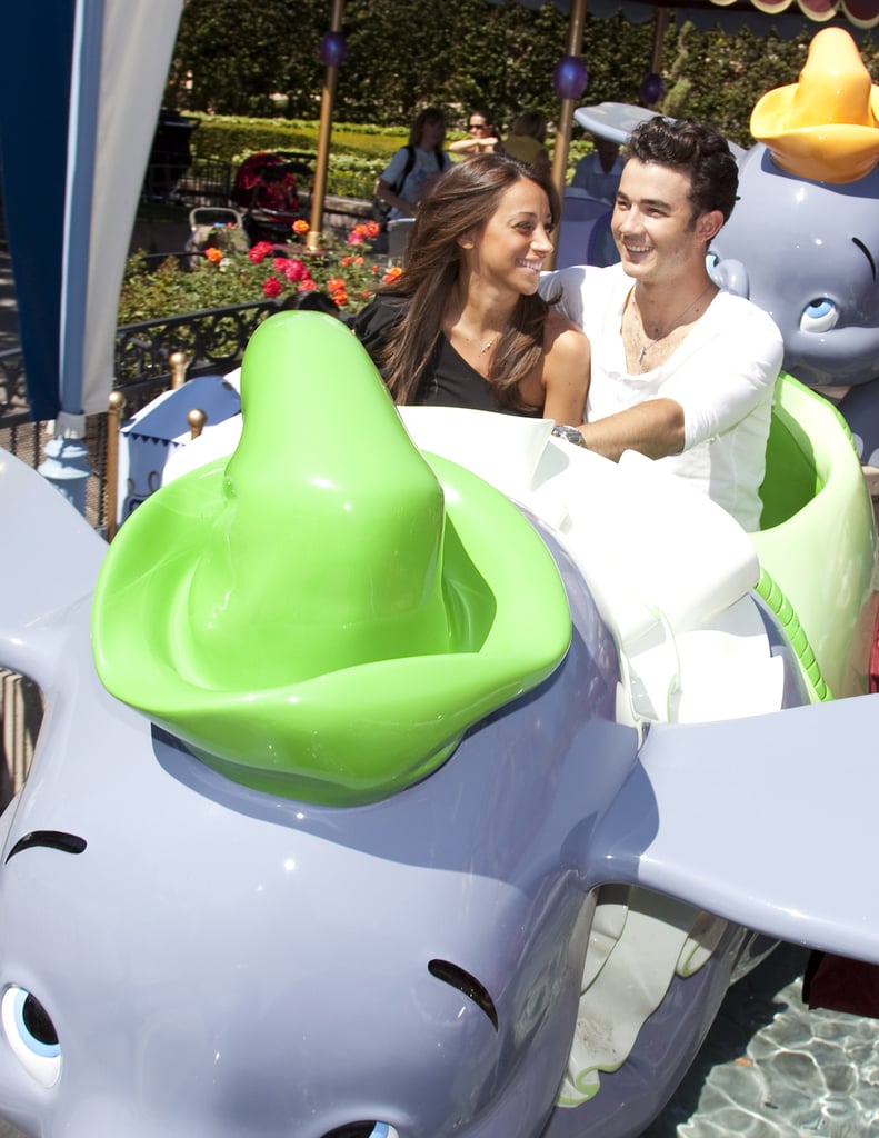 Kevin and Danielle Jonas shared a seat on the Dumbo ride in April 2011.