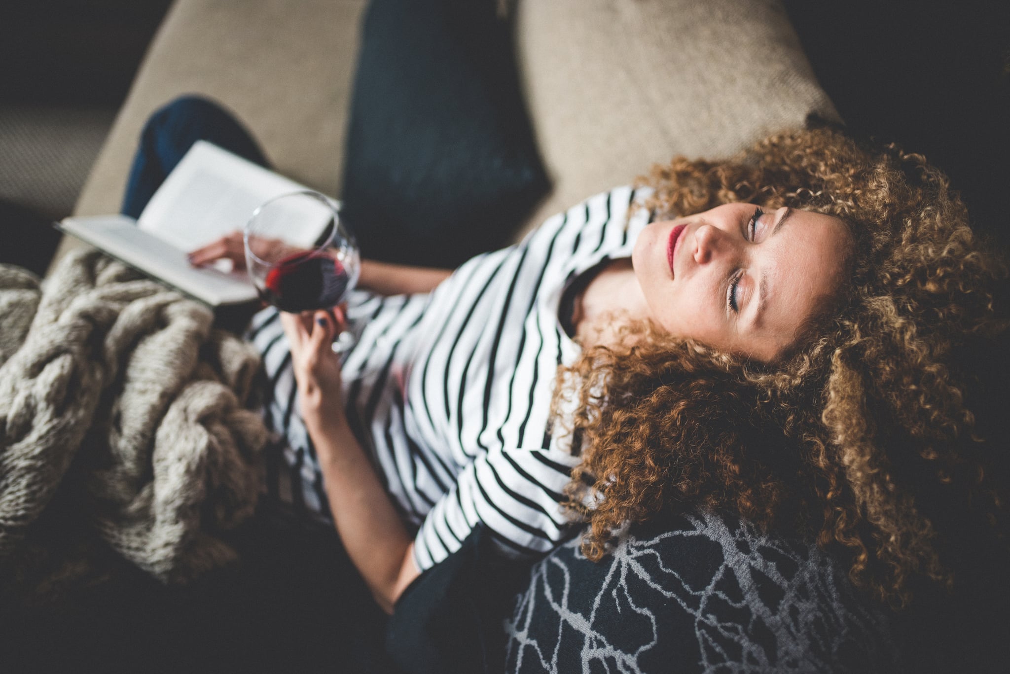 Relaxed young woman reading a book