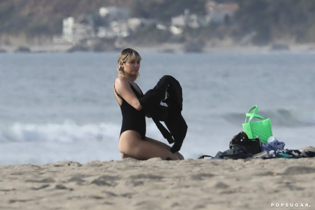 Miley Cyrus's Black Swimsuit With Logo Straps at the Beach