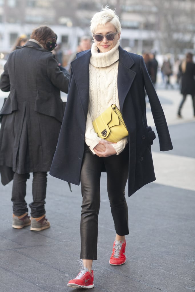 The easiest way to stay comfy — and styled — with bright Nikes and Westward Leaning sunglasses to complement her leather pants and understated knit.
The easiest way to stay comfy — and styled — with bright Nikes and Westward Leaning sunglasses to complement her leather pants and understated knit.