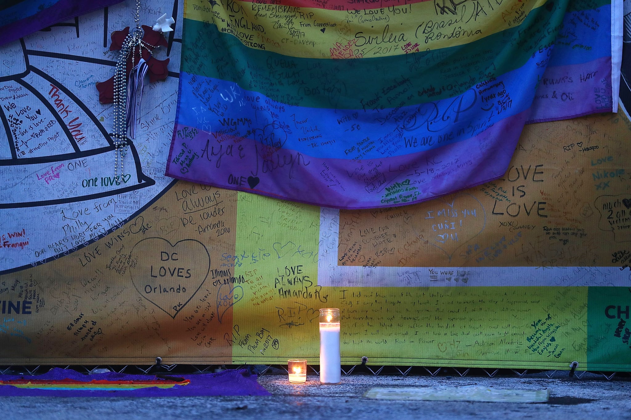 ORLANDO, FL - JUNE 12: A candle is displayed in the memorial set up outside the Pulse gay nightclub in memory of the victims of a mass shooting at the club one year ago on June 12, 2017 in Orlando, Florida. Omar Mateen killed 49 people at the club a little after 2 a.m. on June 12, 2016.  (Photo by Joe Raedle/Getty Images)