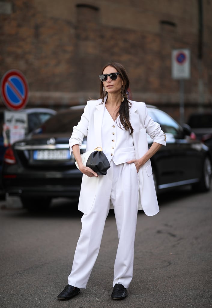 Ground an all-white look with a pair of black flats—whether booties, loafers, or ballets alike.
