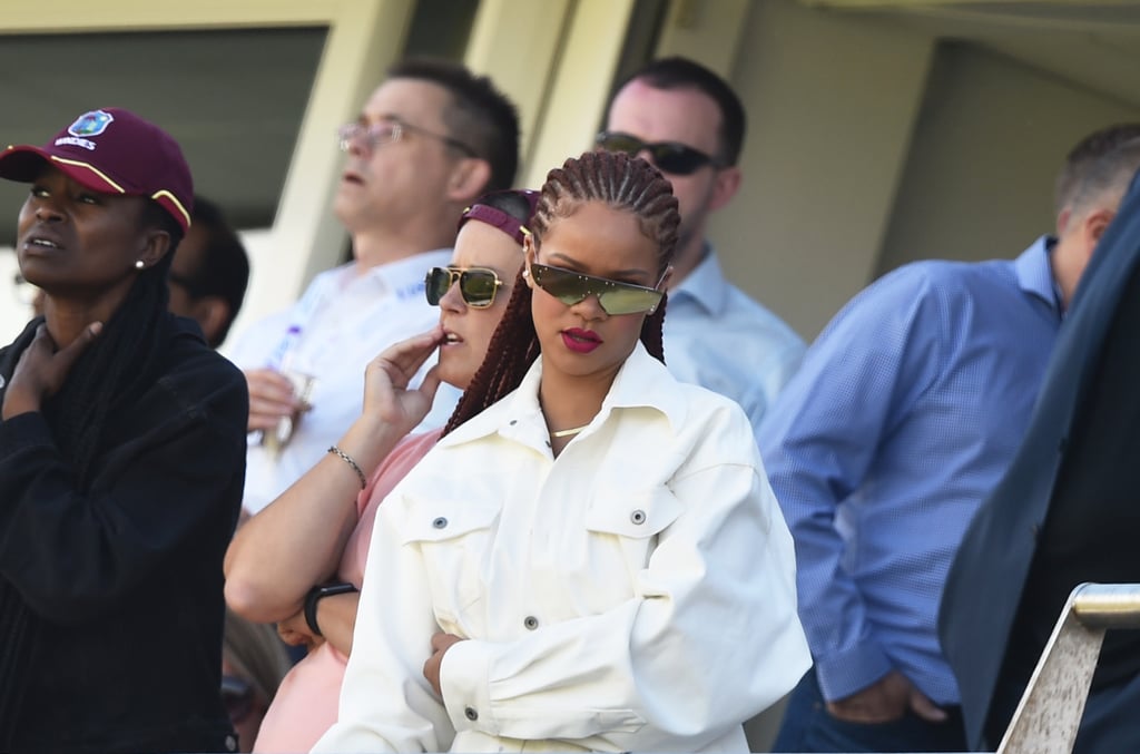 Rihanna Wearing a Baseball Cap and White Jeans