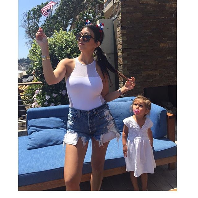 Kourtney Kardashian's daughter, Penelope, adorably looked up at her mom in this sun-soaked photo.