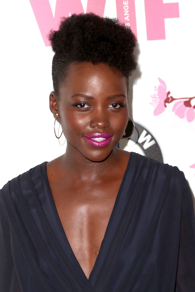 First Lancome memory: 
"Using one of its blushes for my first big red carpet at the Toronto Film Festival. I just remember thinking, 'Wow.' Blush can often be a rather foreign idea for dark skin. It can also look kind of contrived or forced, because we don't blush naturally. It gave a rosiness, a warmth, to my face without being too obvious or too conspicuous, and I liked that."
Specific color recommendations for wearing blush if you have a deeper skin tone?
"I would say that you want to go with the plumier colors more so than the peachier colors. It just needs to be a little deeper."
What inspires her bold-colored makeup choices on the red carpet?
"I want to have fun, and I am lucky enough to get to play dress-up very often. It's a moment of experimentation and of whimsy and fantasy, really. And I just like to embrace that."