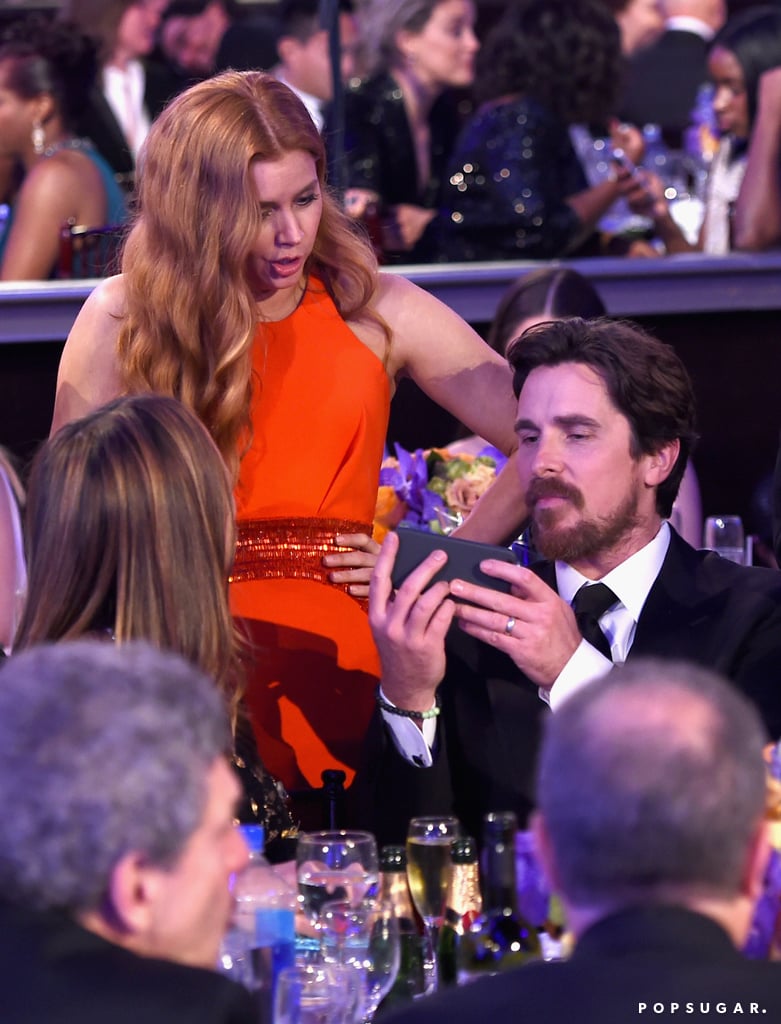 Amy Adams was surprised by something on Christian Bale's phone.