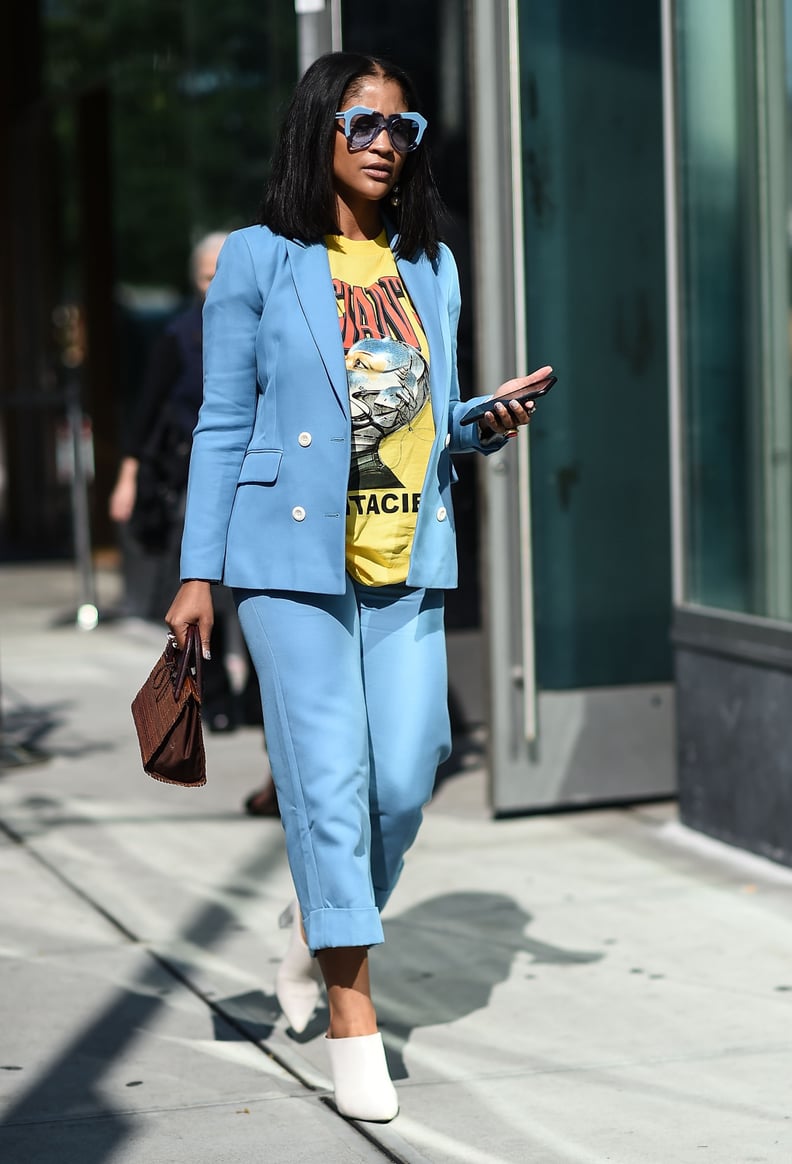 With Funky Sunglasses, Bright Blue Separates, and a Graphic Tee