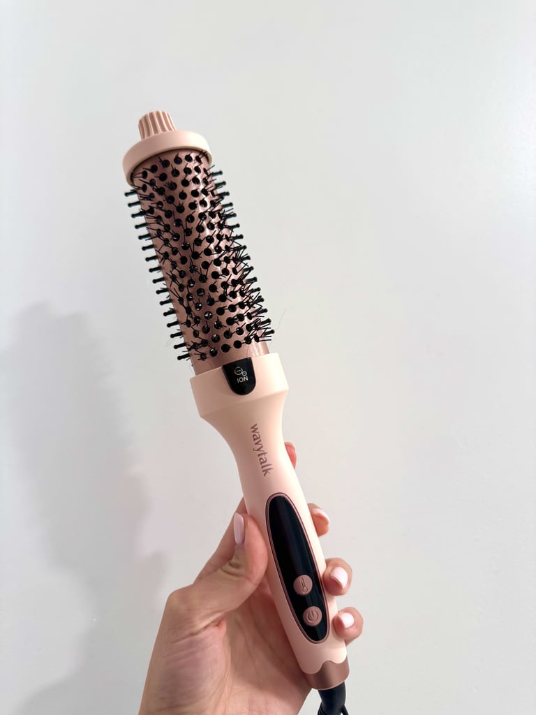 Wavytalk Thermal Brush ($45, originally $60)
If you've been on the fence about buying this TikTok-viral hair tool, now's the time while it's over $15 off for Cyber Monday. 2 units are sold every minute for a reason: the tool manages to reduce frizz and enhance shine with every brush. One editor loved it so much she cancelled her Drybar membership. Read her Wavytalk Thermal Brush review for more details.
Editor Quote: "With the Wavytalk Thermal Brush, though, I'm able to mimic professional results without risking arm cramps (the brush is lighter than a standard blow dryer) or prolonged heat exposure. I also appreciate that the very tip of the brush remains cool to the touch, which allows me to get a firm grip on the hair while pulling it down. Finally, the heated brush is effortless to use: Even on my 2c hair, I only have to do one to two passes per section to achieve smooth results, which ends up being less heat exposure on my hair overall and a significantly shorter styling process." — Michelle Rostamian, PS contributor