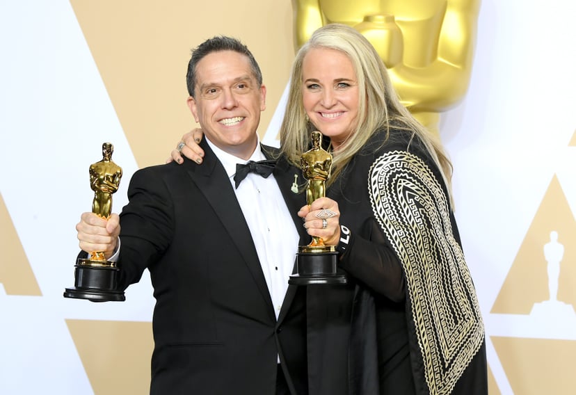 HOLLYWOOD, CA - MARCH 04:  Director Lee Unkrich (L) and Producer Darla K. Anderson, winners of the Animated Feature award for Coco pose in the press room during the 90th Annual Academy Awards at Hollywood & Highland Center on March 4, 2018 in Hollywood,