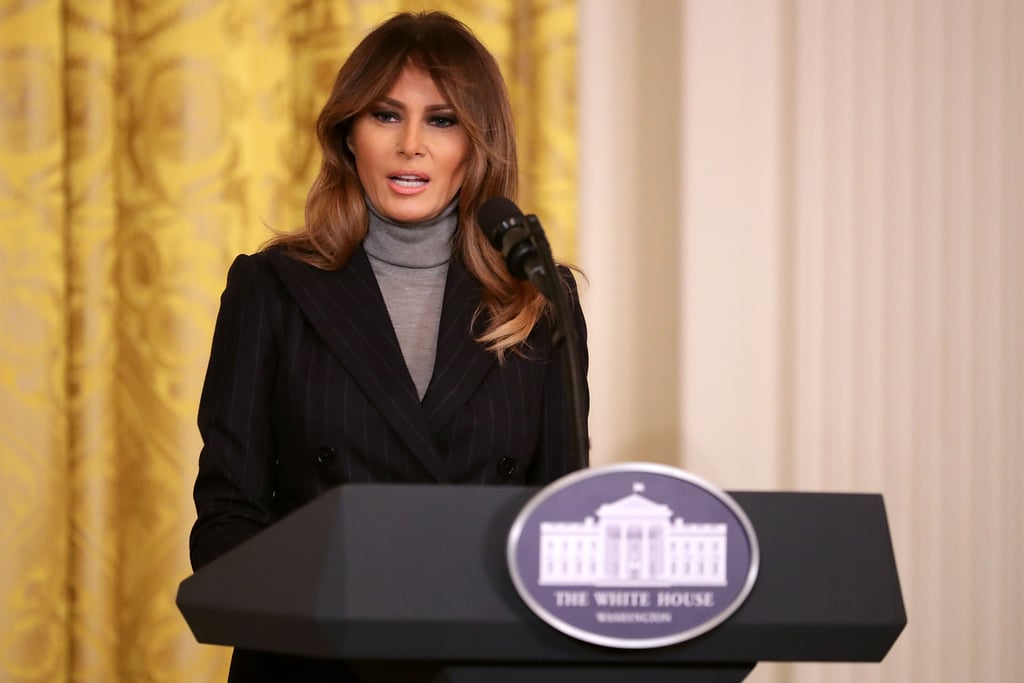 Melania Trump delivered a speech about the ongoing opioid crisis at a White House summit on March 1. For the event, she discussed the administration's work to combat the issue while wearing a polished outfit: a navy, double-breasted pinstripe suit. Rather than styling her suit with a blouse or a button-down shirt, Melania decided to take a styling cue from Steve Jobs and wear a turtleneck sweater underneath. The first lady wore a similar suit in gray while welcoming Canada's Prime Minister Justin Trudeau and his wife, Sophie, to the White House back in October. Read on to get a closer look at Melania's outfit, then shop similar sweaters ahead.

    Related:

            
            
                                    
                            

            The 1 Accessory Melania Trump Wears From A.M. to P.M. — No Questions Asked