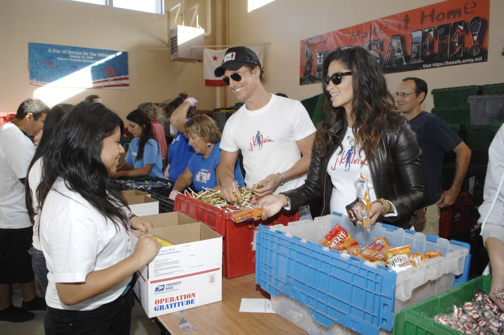 Matthew and Camila smiled while doing charity work at the Operation Gratitude event in LA in October 2009.
