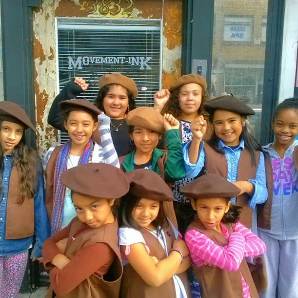 The troop dons berets in homage to social justice groups of decades past, such as the Black Panthers and the Brown Berets.
