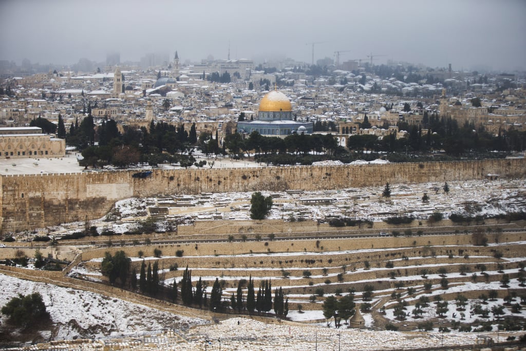 A snowstorm moved through Jerusalem, leaving the Dome of the Rock at the Al-Aqsa mosque covered with snow.