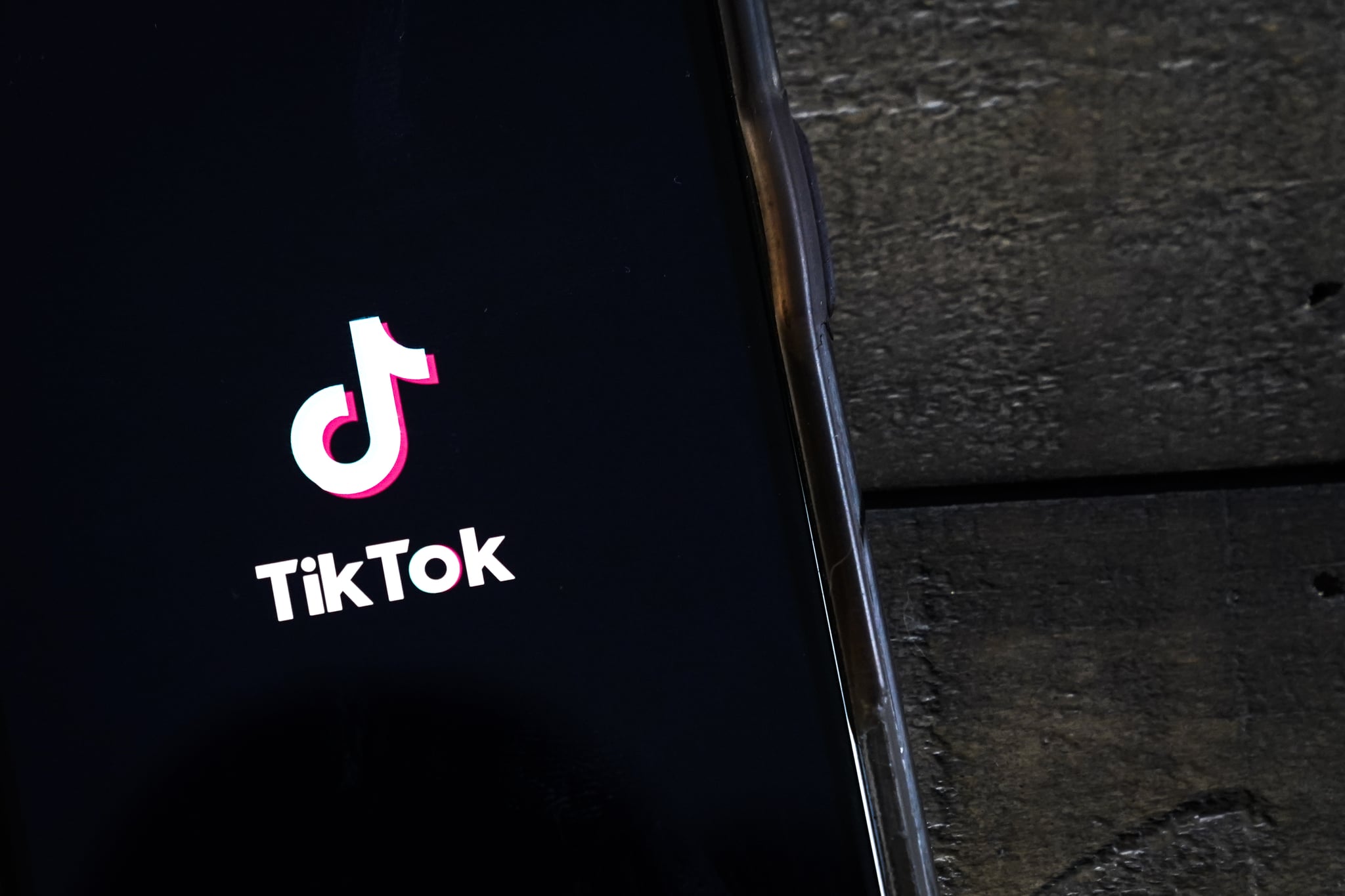 WASHINGTON, DC - AUGUST 07: In this photo illustration, the TikTok app is displayed on an Apple iPhone on August 7, 2020 in Washington, DC. On Thursday evening, President Donald Trump signed an executive order that bans any transactions between the parent company of TikTok, ByteDance, and U.S. citizens due to national security reasons. The president signed a separate executive order banning transactions with China-based tech company Tencent, which owns the app WeChat. Both orders are set to take effect in 45 days. (Photo Illustration by Drew Angerer/Getty Images)