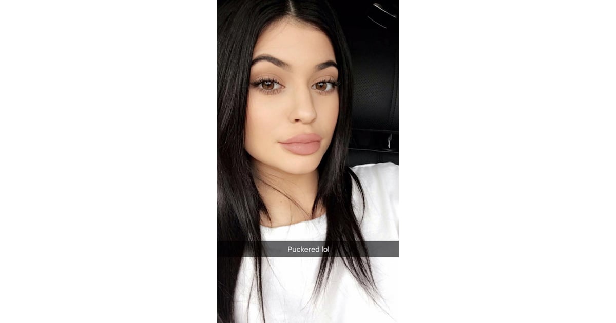 Kylie’s puckered look, showcasing pursed lips. Kylie Jenner Lip