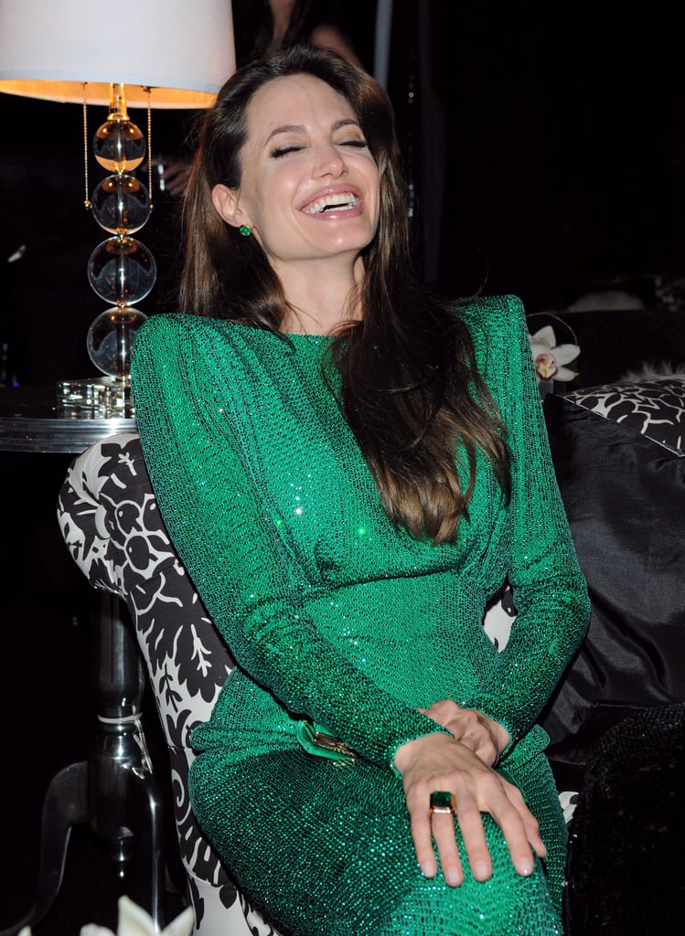 Angelina Jolie cracked herself up during the Sony afterparty in 2011.