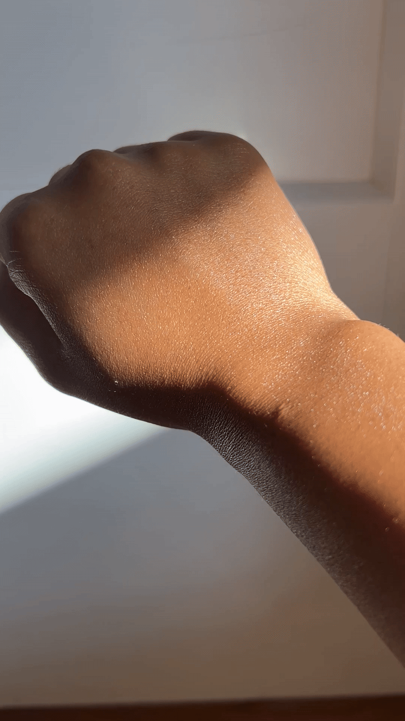 The sheen and hydration of the Squigs Beauty Double Shot Face Serum on my hand.