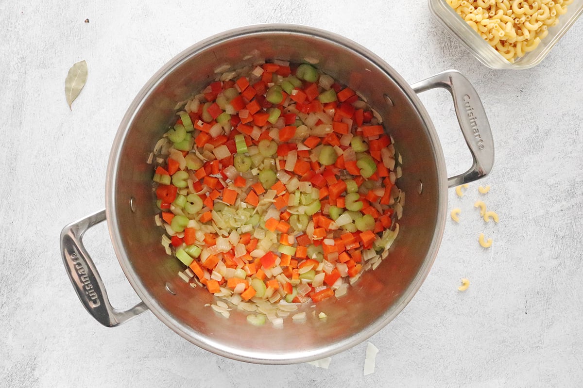 Cook onions, carrots, and celery