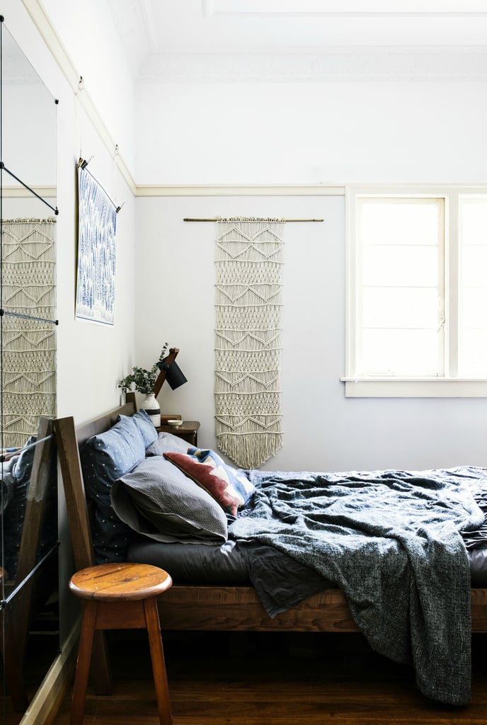 A white woven wall hanging adds subtle interest without detracting from the neutral palette.