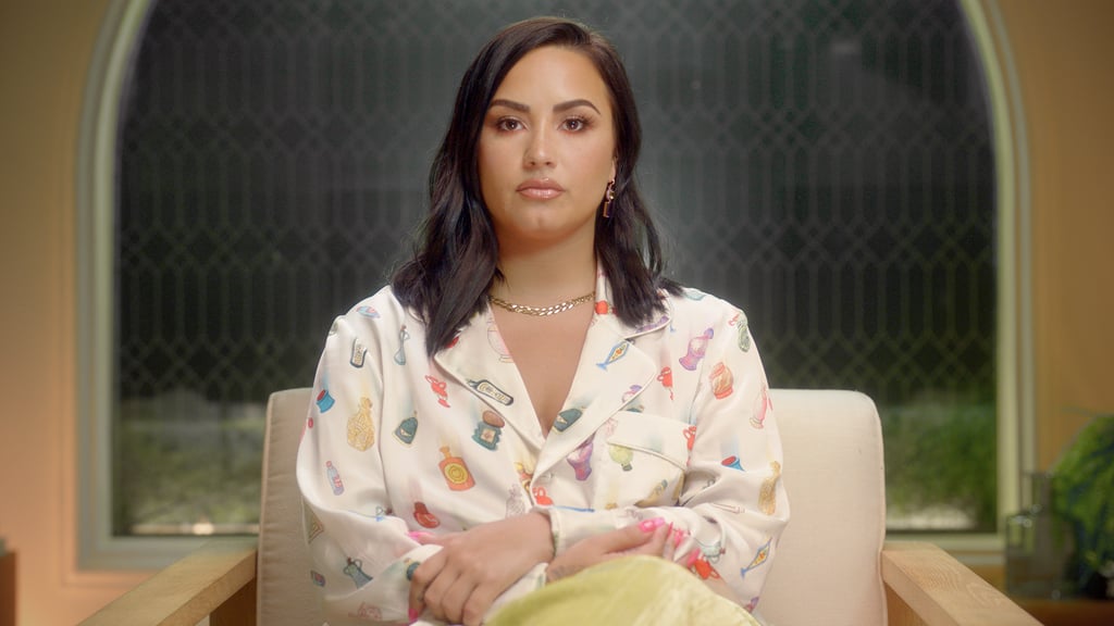 Sending a message? Lovato gave a stern look to the cameras in a Casablanca long-sleeved shirt printed with tiny bottles in Dancing with the Devil in 2020.