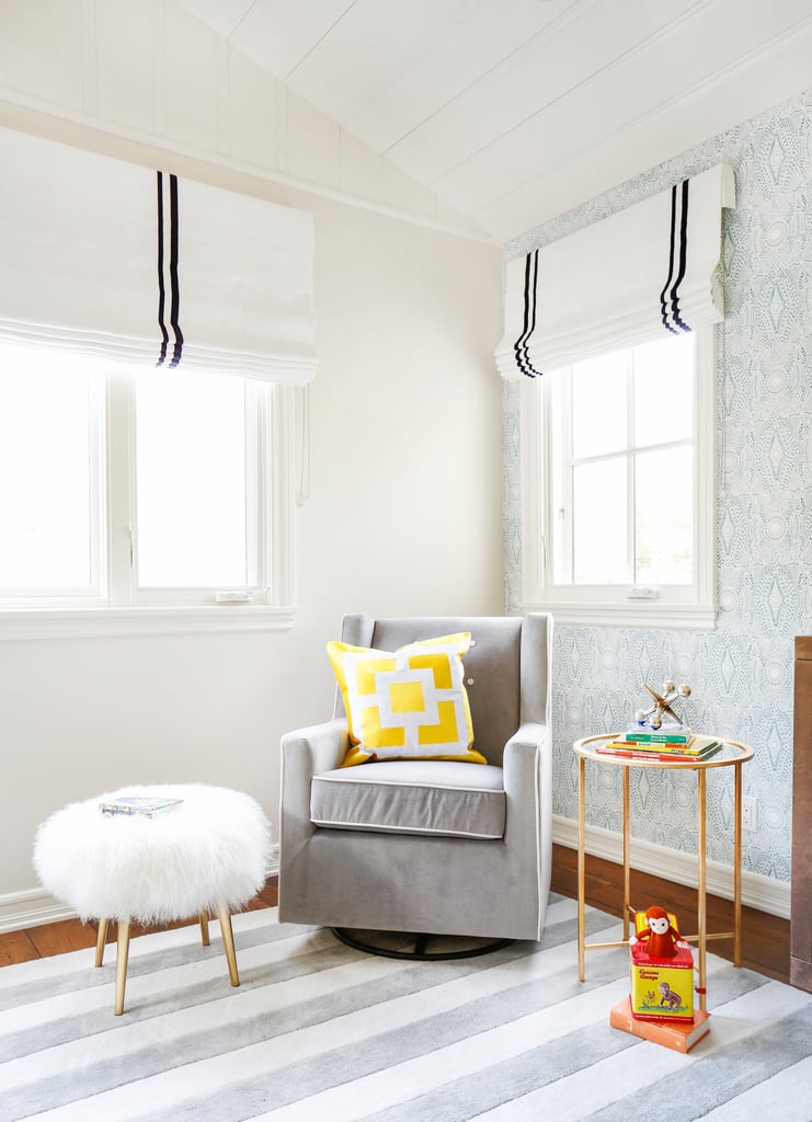 A glider and mohair stool make this cozy corner perfect for nursing, giving a bottle, or just getting in some good cuddle time. The roman shades are lined with blackout fabric, a must have for napping babies.