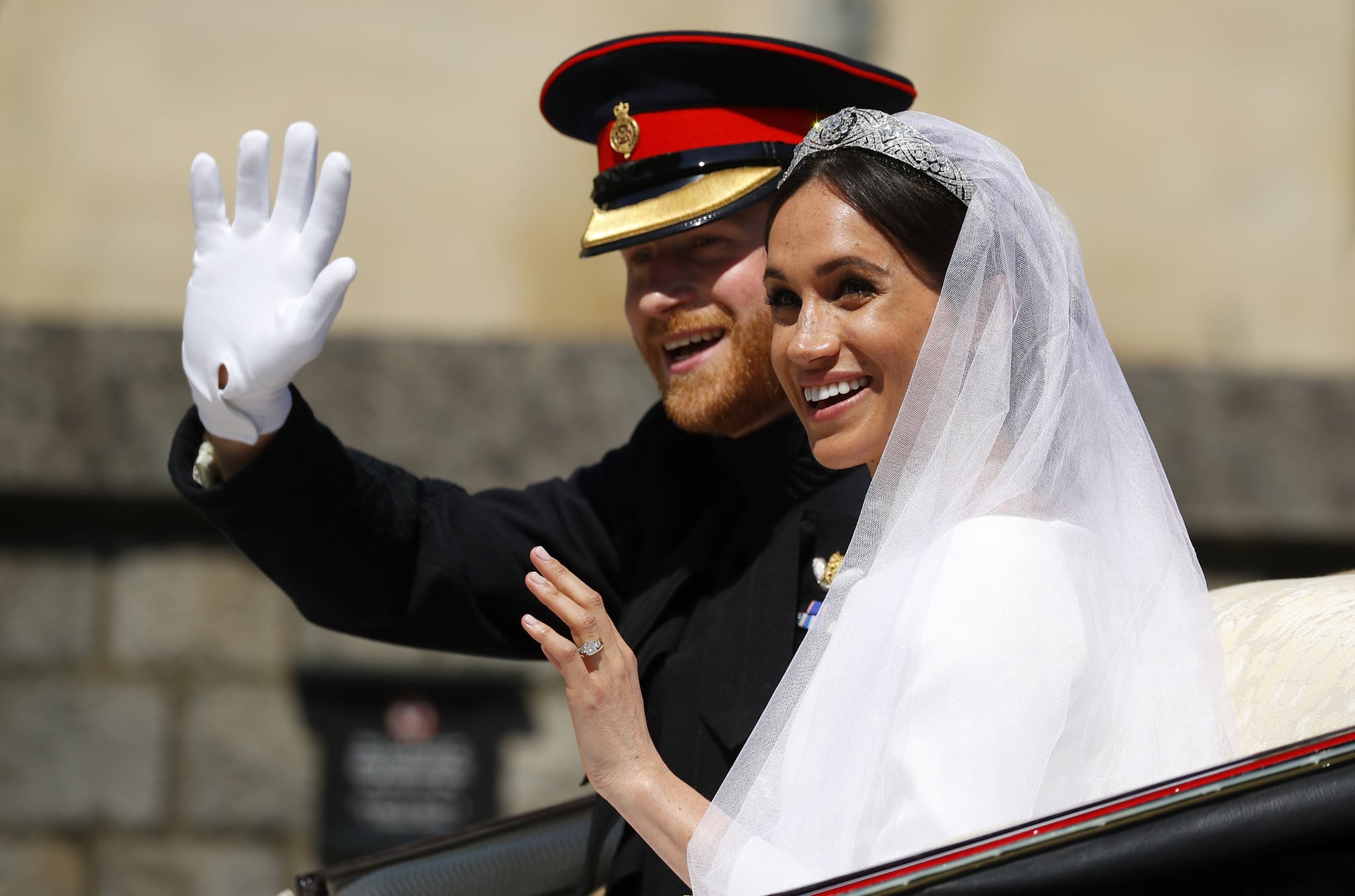 WINDSOR, ENGLAND - MAY 19:  Prince Harry, Duke of Sussex and The Duchess of Sussex leave Windsor Castle in the Ascot Landau carriage during a procession after getting married at St Georges Chapel on May 19, 2018 in Windsor, England.  (Photo by Phil Noble - WPA/Getty Images)