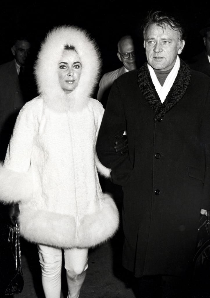 Elizabeth bundled up in a white fur coat with a fuzzy hood in 1982.