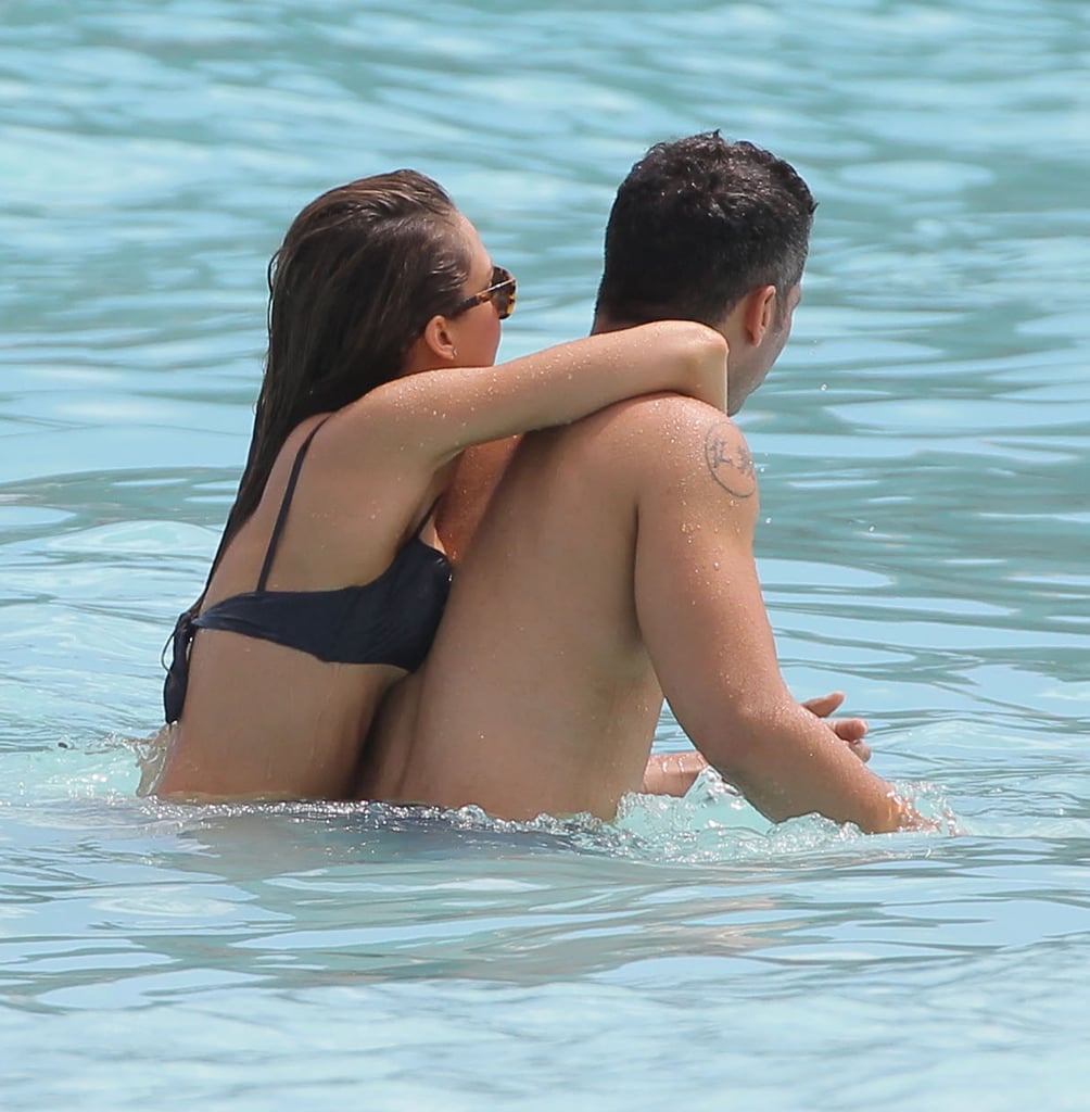 Jessica and Cash cuddled in the water while in St. Barts in April 2013.