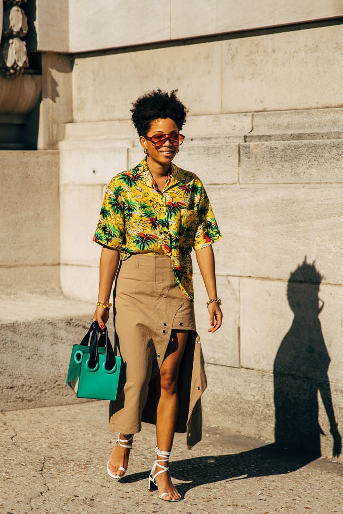 Style a pair of lace-up sandals with a tropical shirt and midi skirt.