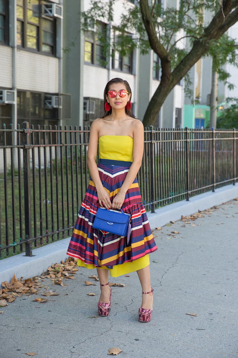 A Patterned Midi Skirt Layered Over a Sunny Strapless Dress to Make You Feel Smart