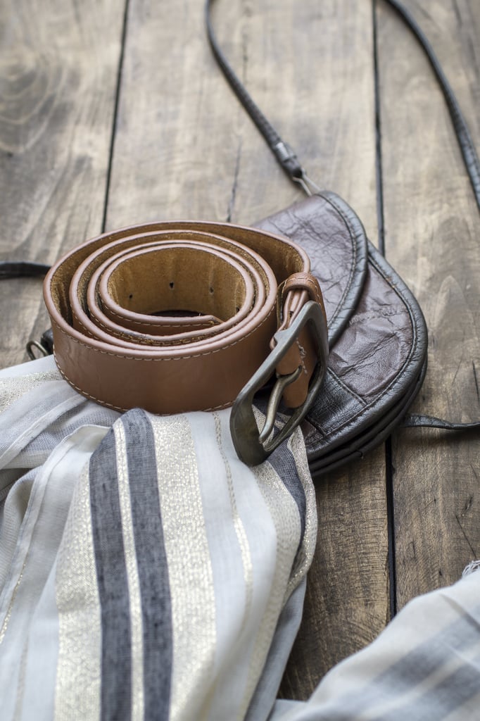 Place a belt in the collar of a shirt.